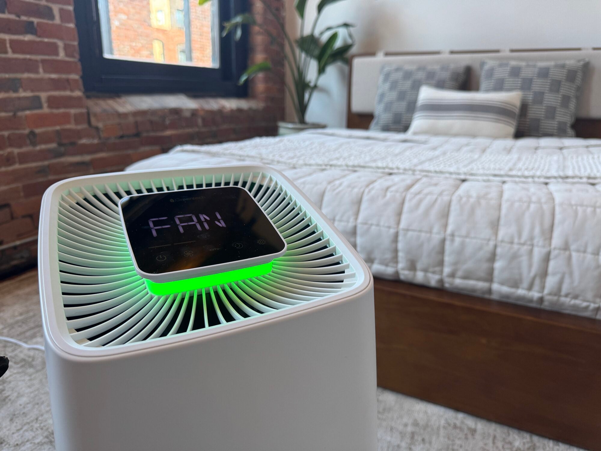 Superstratum Ion air purifier running in a sunlit loft bedroom